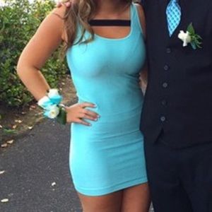 Bodycon aqua BEBE mini dress with black detail